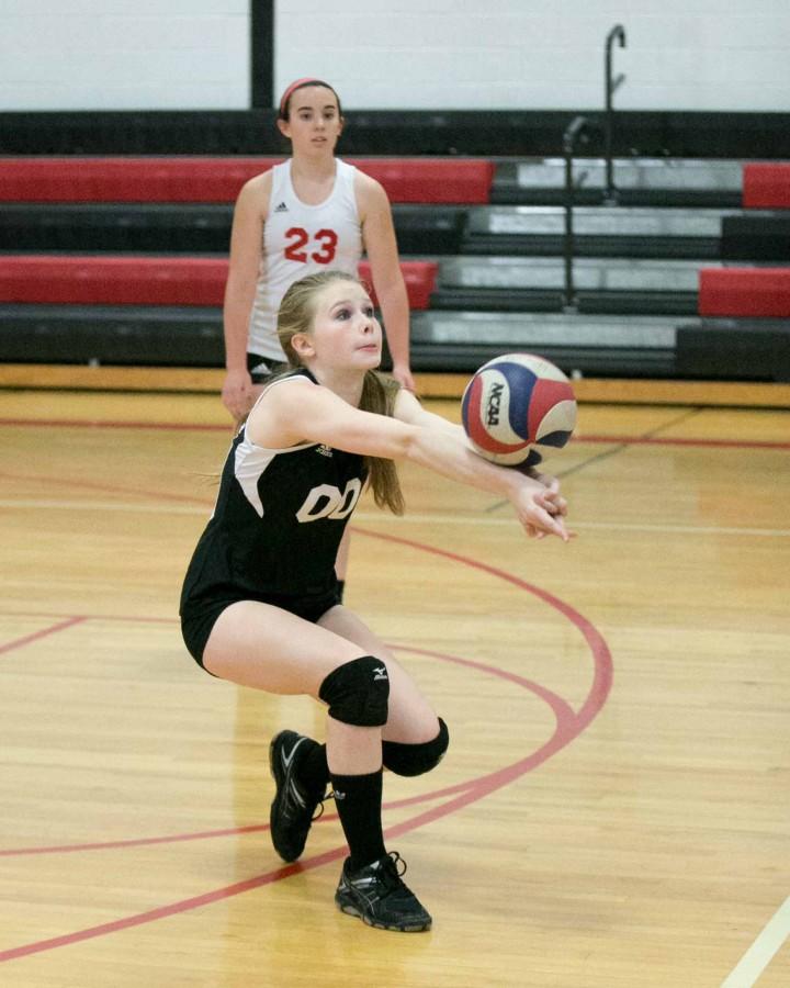 Senior Megan Coslove passes the ball to her teammate. 