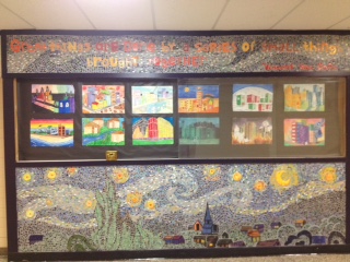 A mosaic completed by art students showcases the work of future students. It features the quote Great things are done by a series of small things brought together. -Vincent Van Gogh 