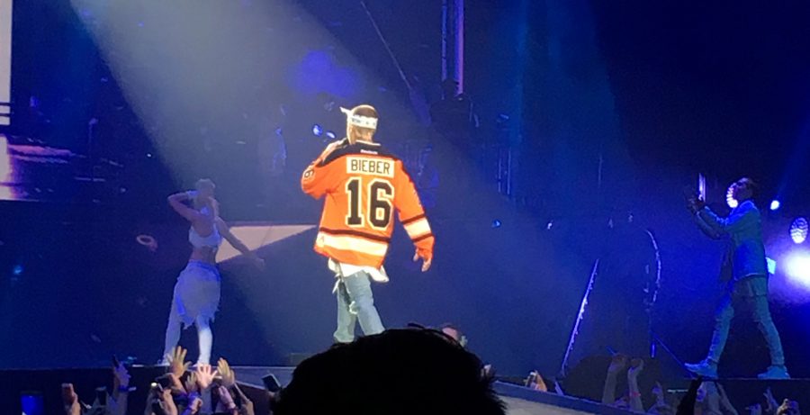 Justin Bieber comes on stage in a Flyers jersey that had been retired for the greatest all-time Flyer, Bobby Clarke, but was revived with the Biebs name for this past weekend