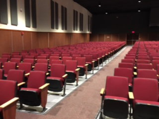 A view of the new auditorium shows that the aisles were removed next to the wall, so only the aisle between the three sections remain