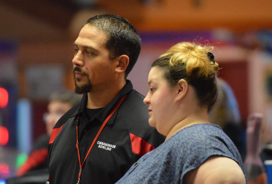 Coaches Anthony Faltz and Megan McGinley discuss strategy before a match during the CHS season.