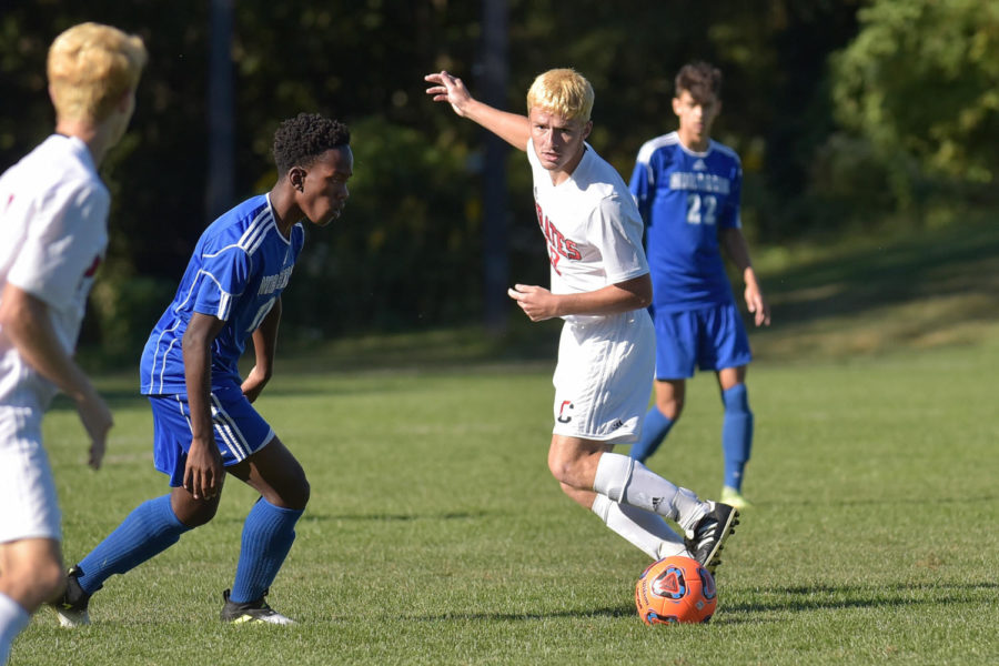 Junior Shane Spence plays a ball at midfield against Northern Burlington in the Cinnaminson 1-1 tie on October 2.