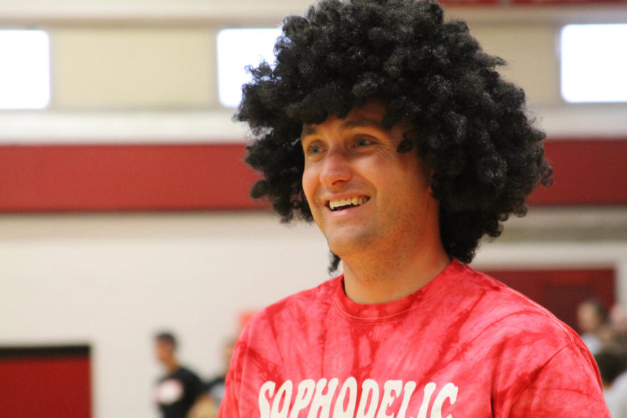 Mr. Meile having fun donning a wig at a Homecoming pep rally