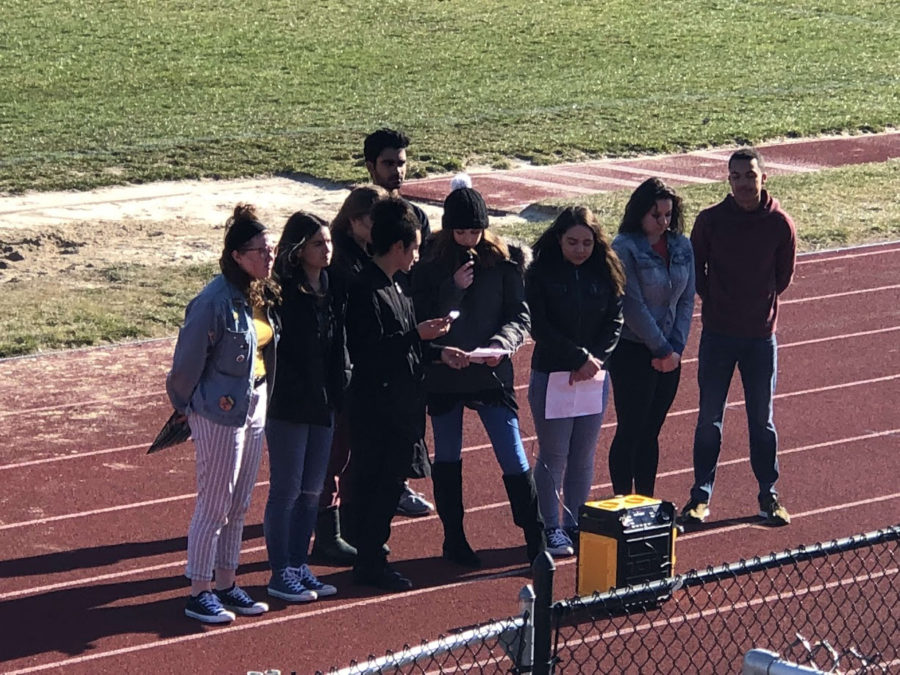 Erinkimber Cunnane, Lily Myers, Nick Hanni, Julia Carlin, Laini Parejo, Casey Koukoski, Justin Arnold, Hope Addlesberger (back left) and Milan Patel (back right) gather for the presentations for the student walk-out on March 14.