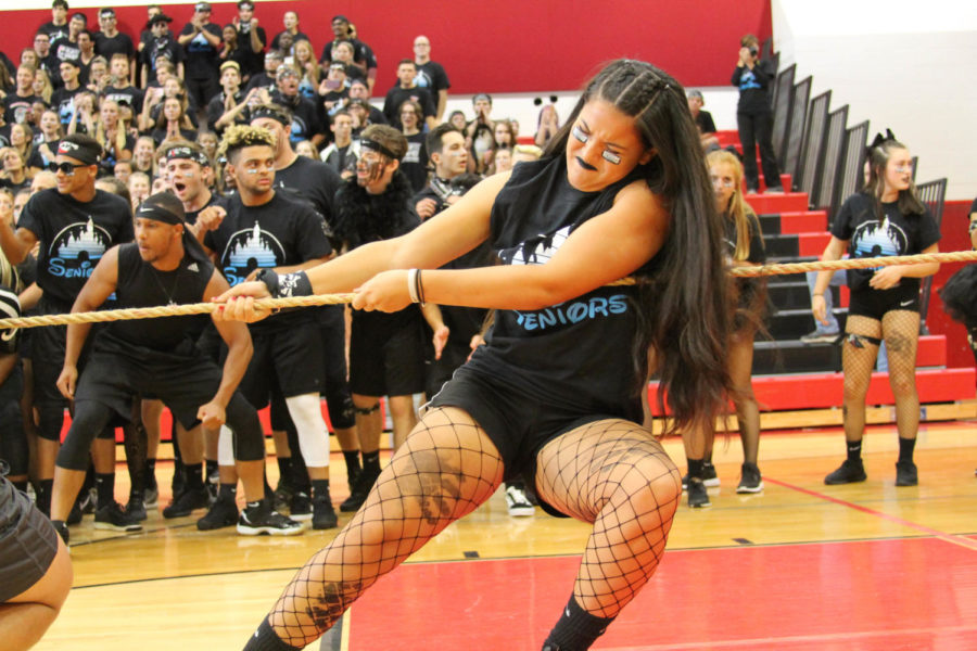 Senior Elena Keck pulls with all her prodigious might during the tug of war that the seniors ended up winning.