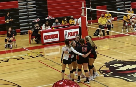 The volleyball team huddles together during their senior night game. (photos courtesy of Katelyn Vogel)
