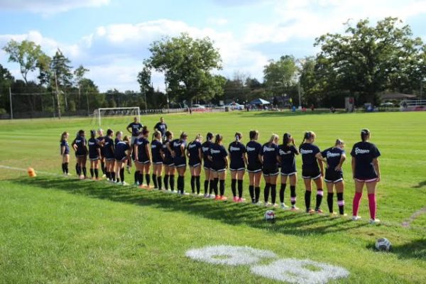 (Photo courtesy of )
The team stands for the national anthem before their game.
