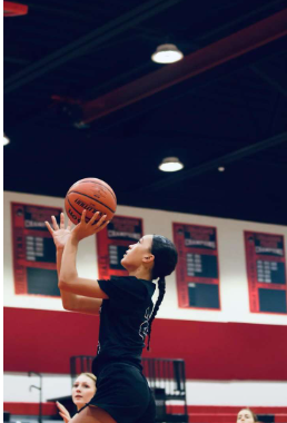 (Photo Courtesy of JP McDevitt) Sophomore Shiloh Moore goes for the basket.