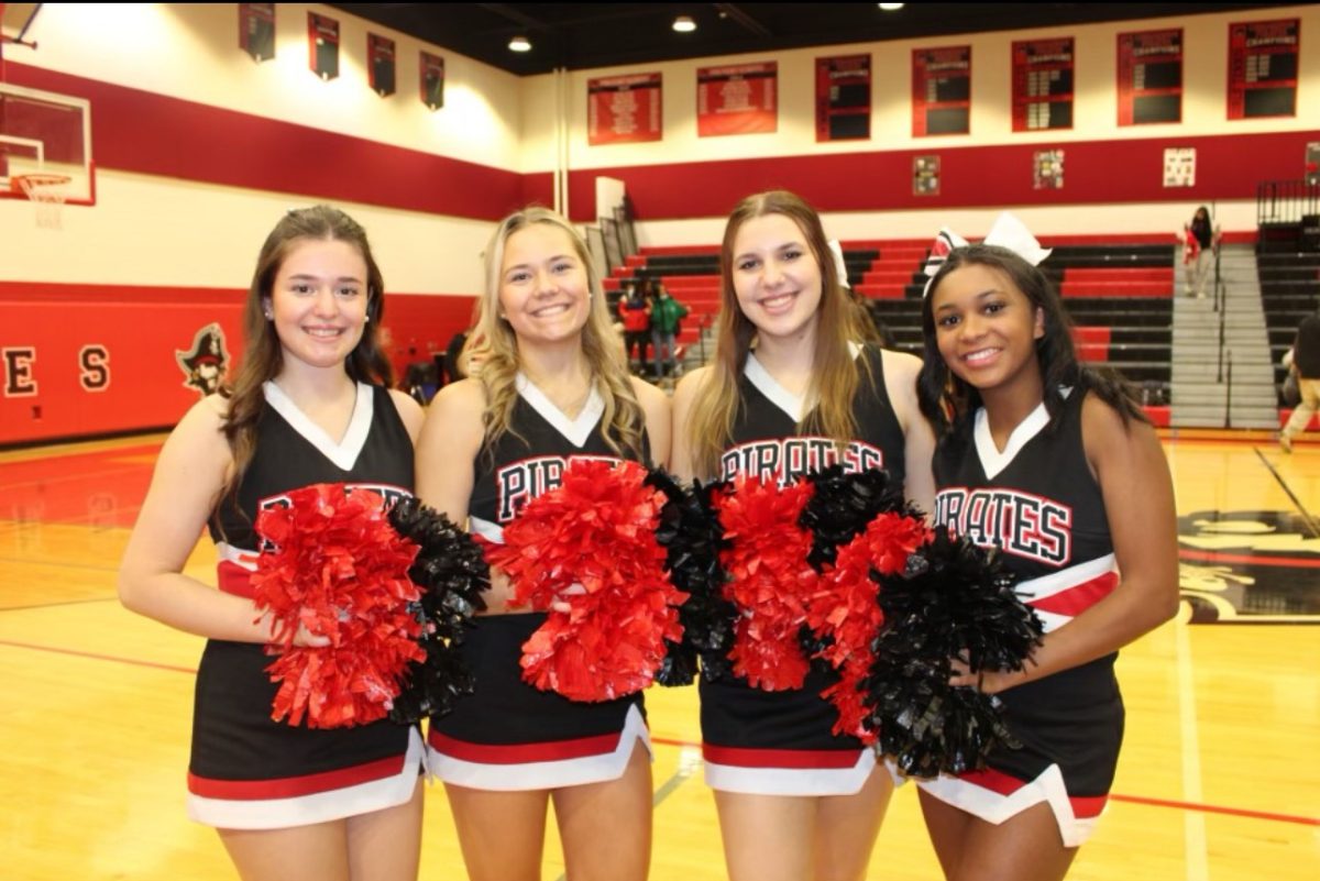 (Photo courtesy of Kayla Meenan). Four of the seven seniors on the winter cheer team. Olivia Kamaras, Kayla Meenan, Alexis Daniels, and Olivia Arnold serve as co-captains for the 30-member squad. 