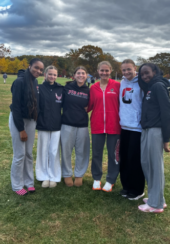 (Courtesy of Colin Heminway) The girls' cross country team races with only six girls this season.