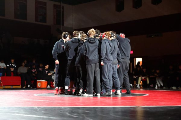 (Photo courtesy of The Buccaneer) The Pirates huddle together before a match at home in the Commitment Gym.  