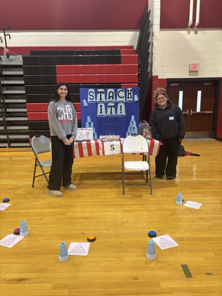 (Photo courtesy of Sophia Sorrentino)
Juniors Bruna Campelo and Omisha Sharma present their game 'Stack It' where students were challenged to answer math questions and stack the cups. 
