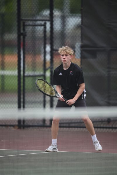 (Courtesy of The Buccaneer)
Sophomore James Coller prepares for a rally at the baseline.