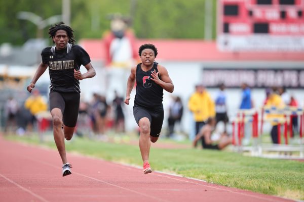 (Courtesy of The Buccaneer) Senior Shawn Munson sprints past competitors in his final season.